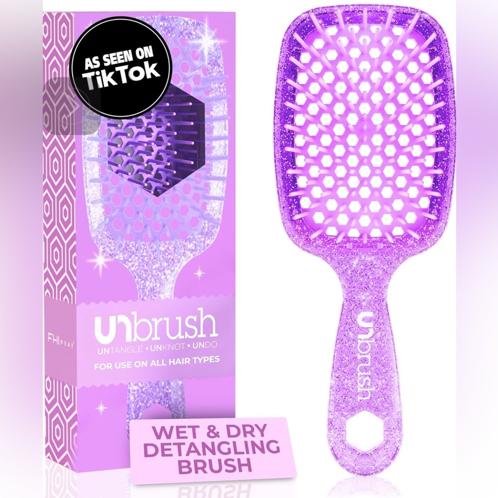 New, in box, Amethyst and Glitter detangling brush.